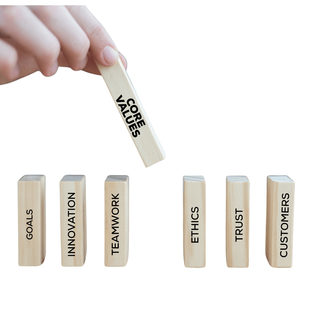 Hand placing a block labeled 'Core Values,' symbolizing the foundation of IT service principles.