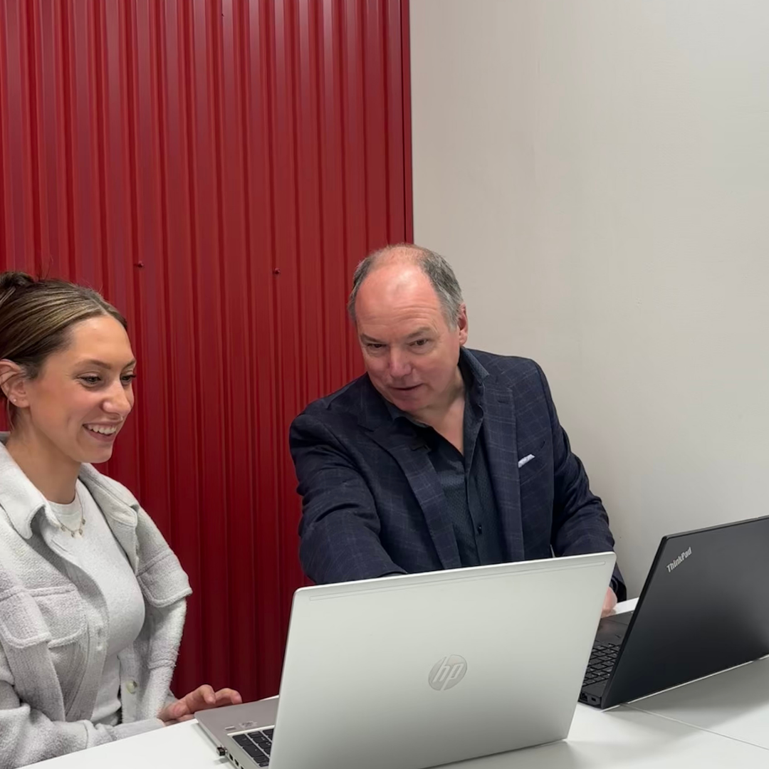 Foundation BTS team member discussing business technology with a client